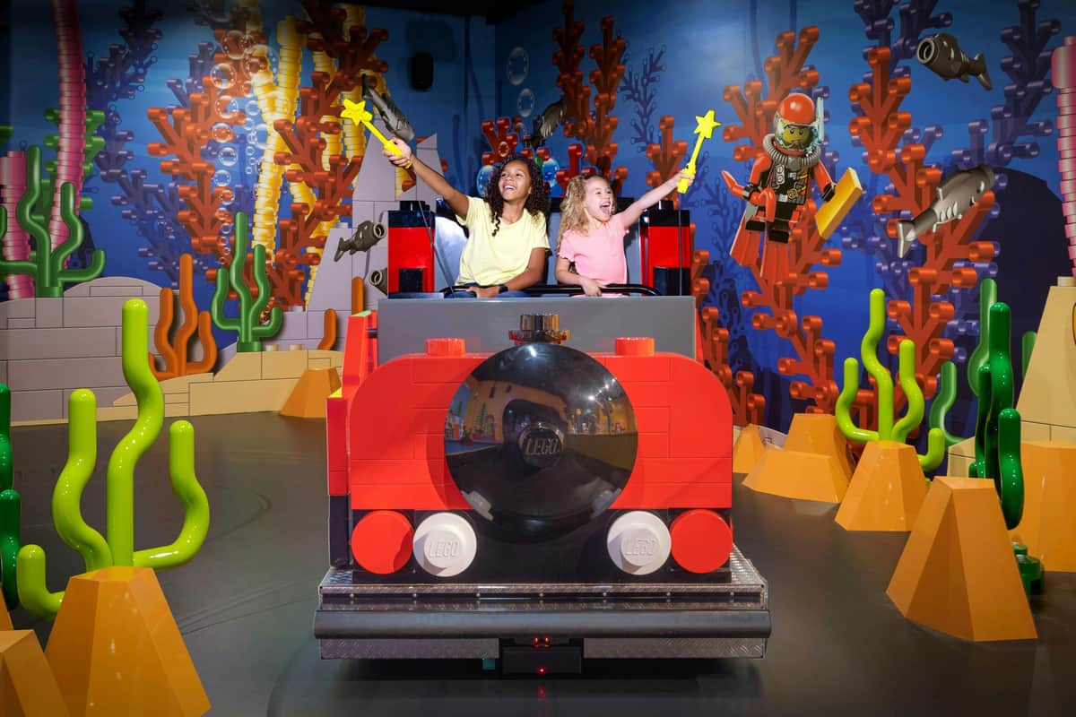 Ride a train in an oversized LEGO WORLD