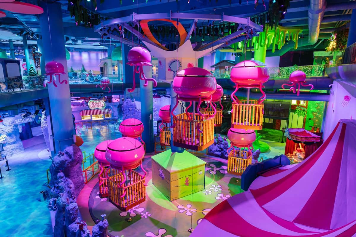 Nickelodeon Play Tersane Istanbul: Entry Ticket A vibrant indoor playground themed around jellyfish, with glowing pink structures and colorful decor under bright lights.
