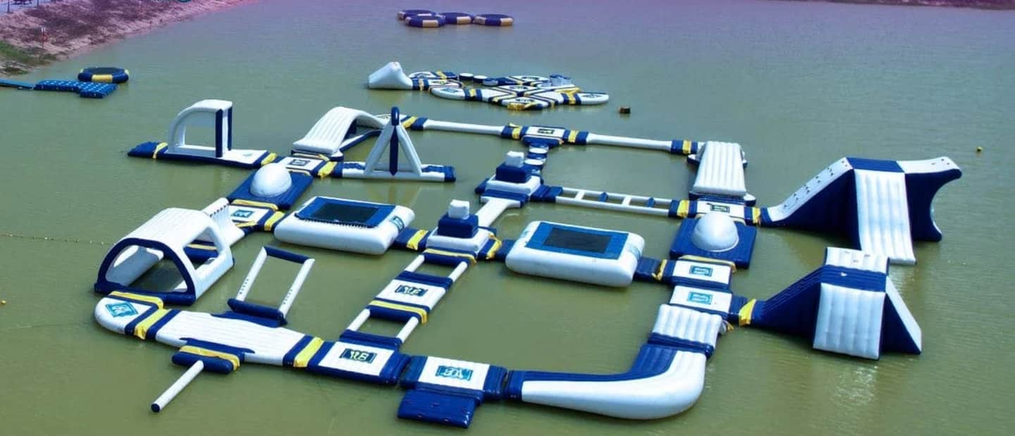 Sanook Park Pattaya Inflatable water park with various interconnected structures and obstacles floating on a lake.