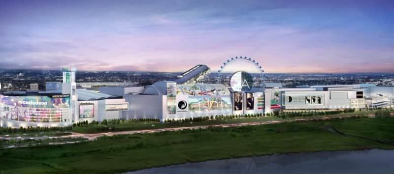 Expansive, illuminated complex with signage, including "Nickelodeon" and "American Dream," featuring a Ferris wheel and vivid displays.