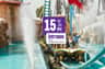 PortAventura Park: Entry Ticket – PortAventura World (Vila-seca) A group of people on a water ride at an amusement park with a promotional sign advertising a 15% discount for tickets.